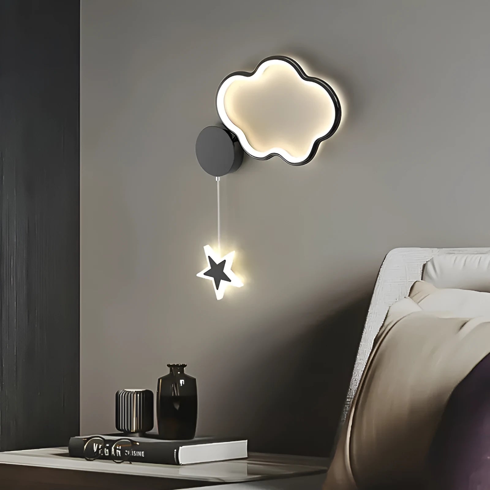 Cartoon cloud, moon and five-pointed star shaped bedside wall lamp for a children's bedroom in black or white.