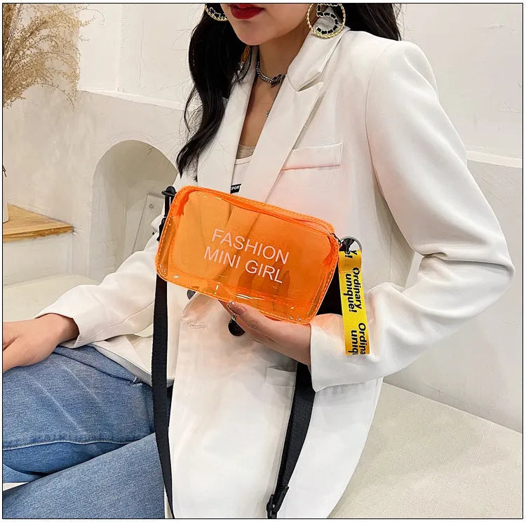 Transparent square jelly shoulder bag with adjustable strap in various colours on a white background.