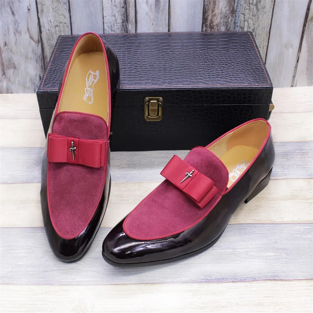 Men's black patent leather dress shoes with a tassel detail and low-top design on a rubber sole.