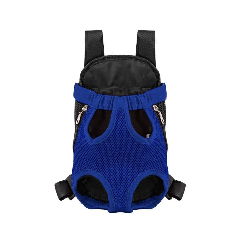 A person wearing a black nylon dog carrier backpack on their chest, containing a small dog looking out.