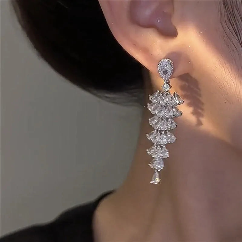 Silver pagoda colour zircon Christmas tree shaped drop dangle earrings on a stud fastening.