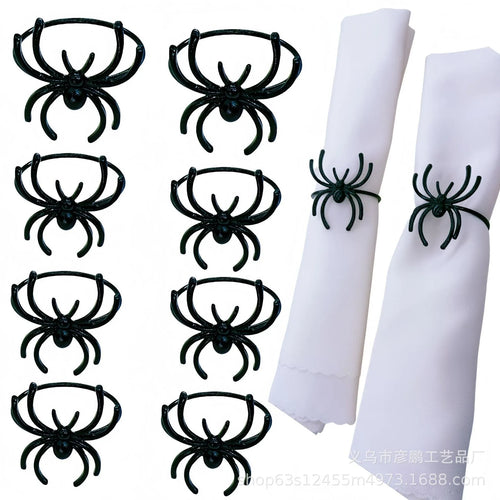 Six black spider-shaped alloy napkin rings for Halloween table decoration
