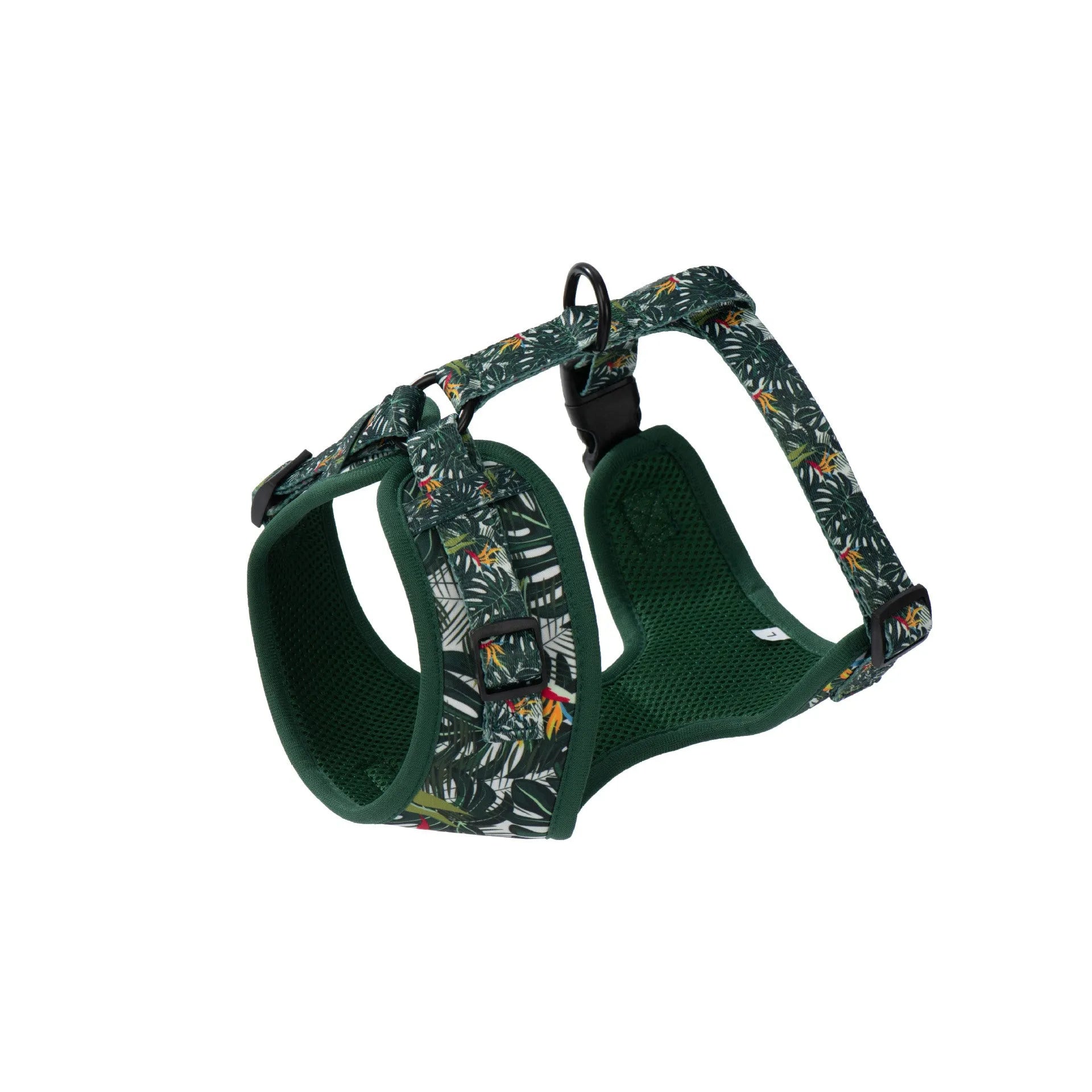 Six-piece adjustable cloth dog harness set on a table, showing vest, collar, rope, waste bag, bow, and triangular scarf.