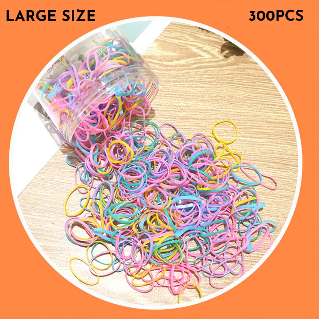 Assortment of colourful small TPU baby hair ties in a reusable plastic container.