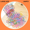 Assortment of colourful small TPU baby hair ties in a reusable plastic container.