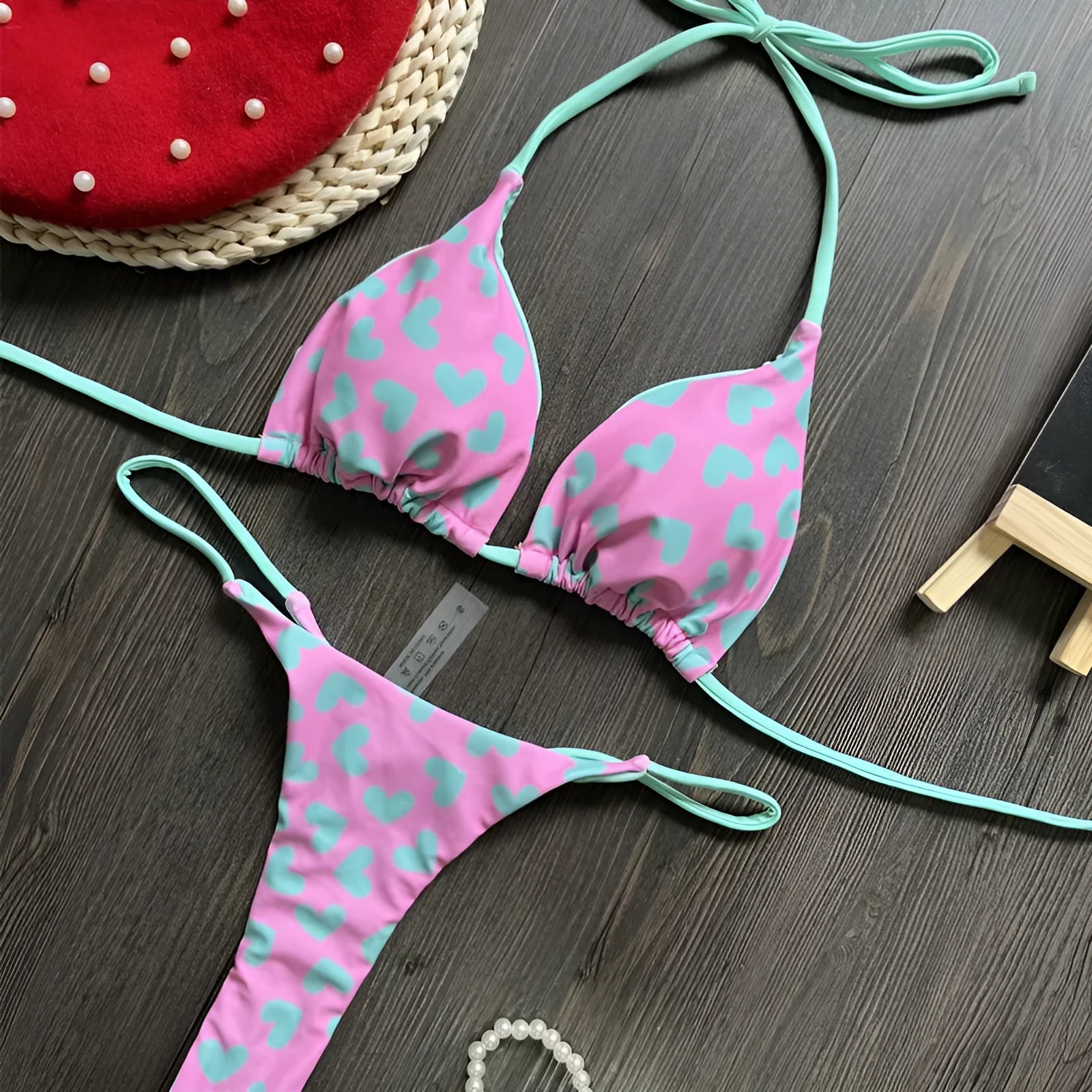 Red backless women's swimsuit with heart print design and high-cut legs