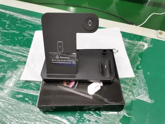 Folding 4-in-1 wireless charger showing iPhone, Apple Watch, AirPods and Apple Pencil charging simultaneously