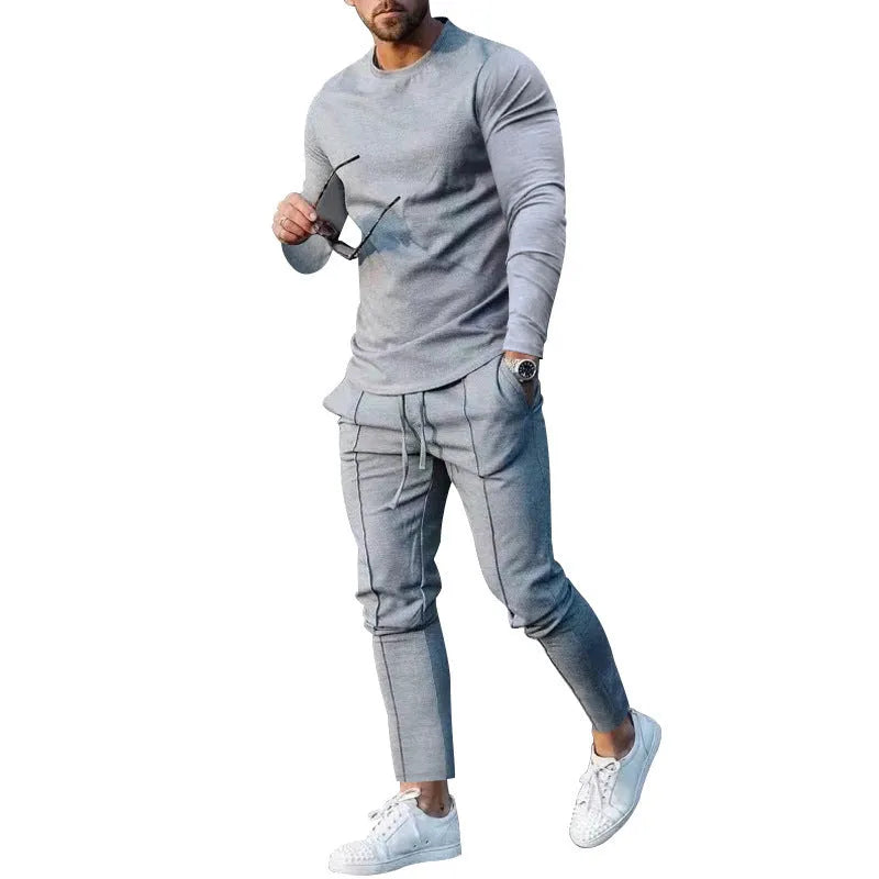 Men's light grey polyester two-piece suit with long sleeve round-neck t-shirt and matching trousers