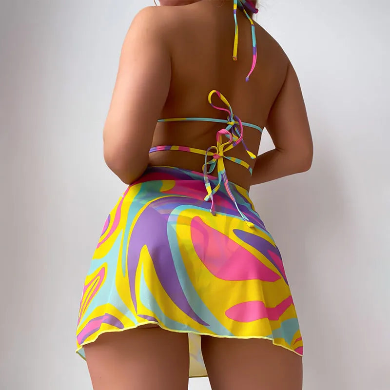Yellow striped print halter neck swimsuit with lace-up front, includes skirt and shorts