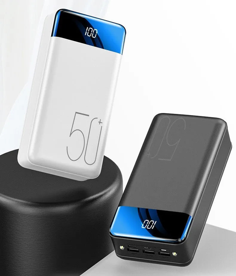 Large 50000mAh power bank with three USB ports in black or white plastic case