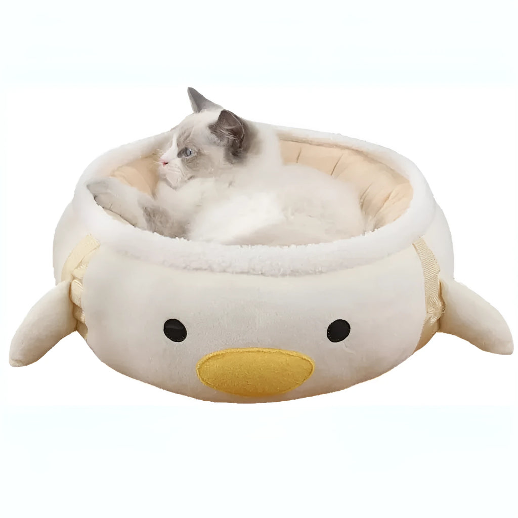 Green dinosaur shaped cat bed with hanging straps shown both flat and as hammock