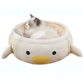 Green dinosaur shaped cat bed with hanging straps shown both flat and as hammock