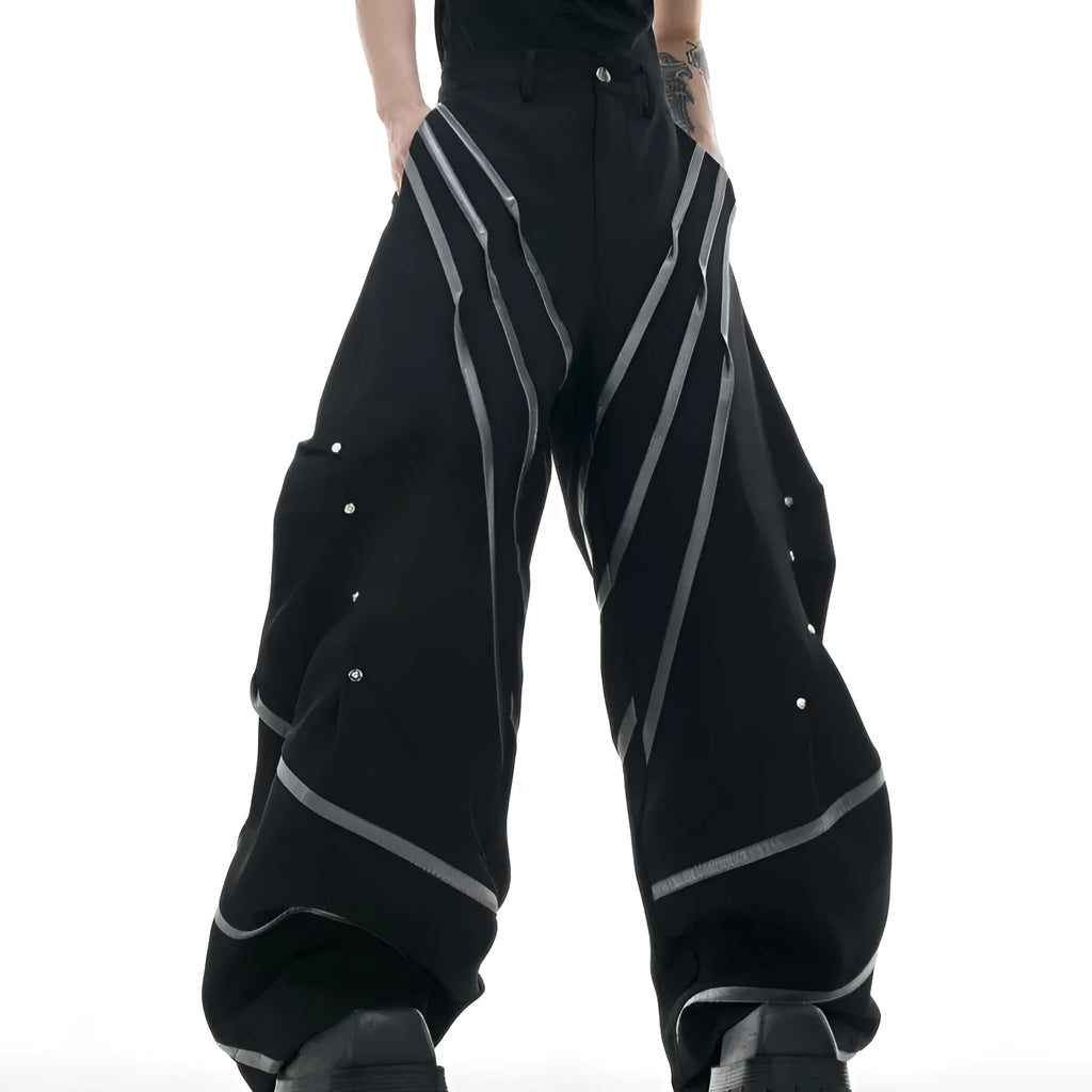 Men's trousers with deconstructed cut, metal striped rivets on pleats, and polyester fabric in black bottom colour