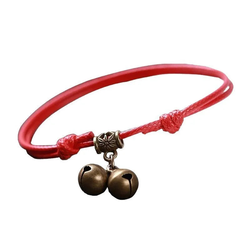 Adjustable black nylon rope dog collar for small dogs featuring a brass bell, shown alongside red and coffee colour options.