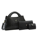 Women's square black crossbody handbag with crocodile pattern texture, showing front zip and adjustable strap.