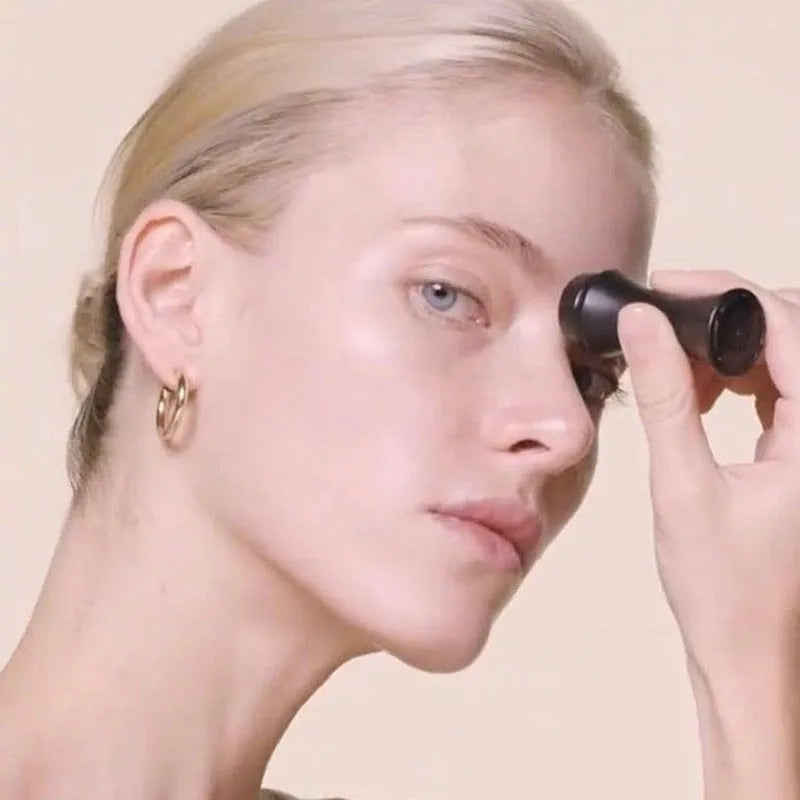 Portable volcanic stone facial roller for oily skin control in black, green, pink, or white.