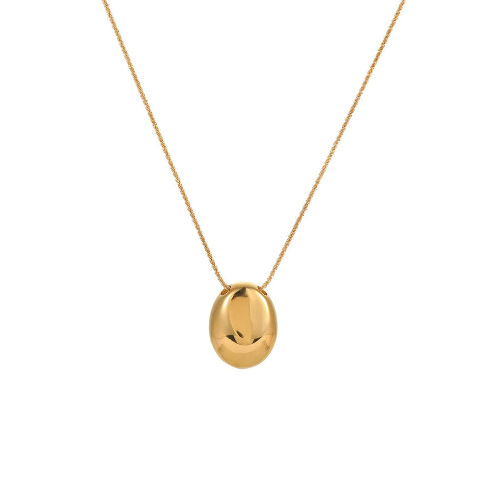 Gold geometric pendant necklace with regular chain on black background showing 41-50cm length