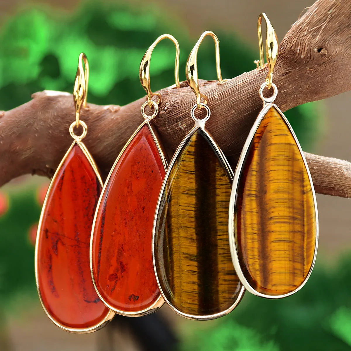 Vintage long water drop earrings in Tigereye stone, showing handmade retro design.