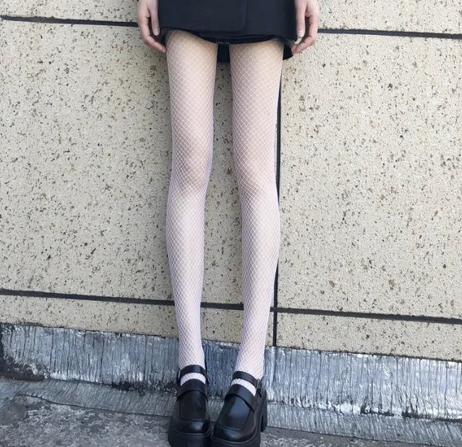 Women's mesh stockings showing large, medium and small net patterns in black and white colours