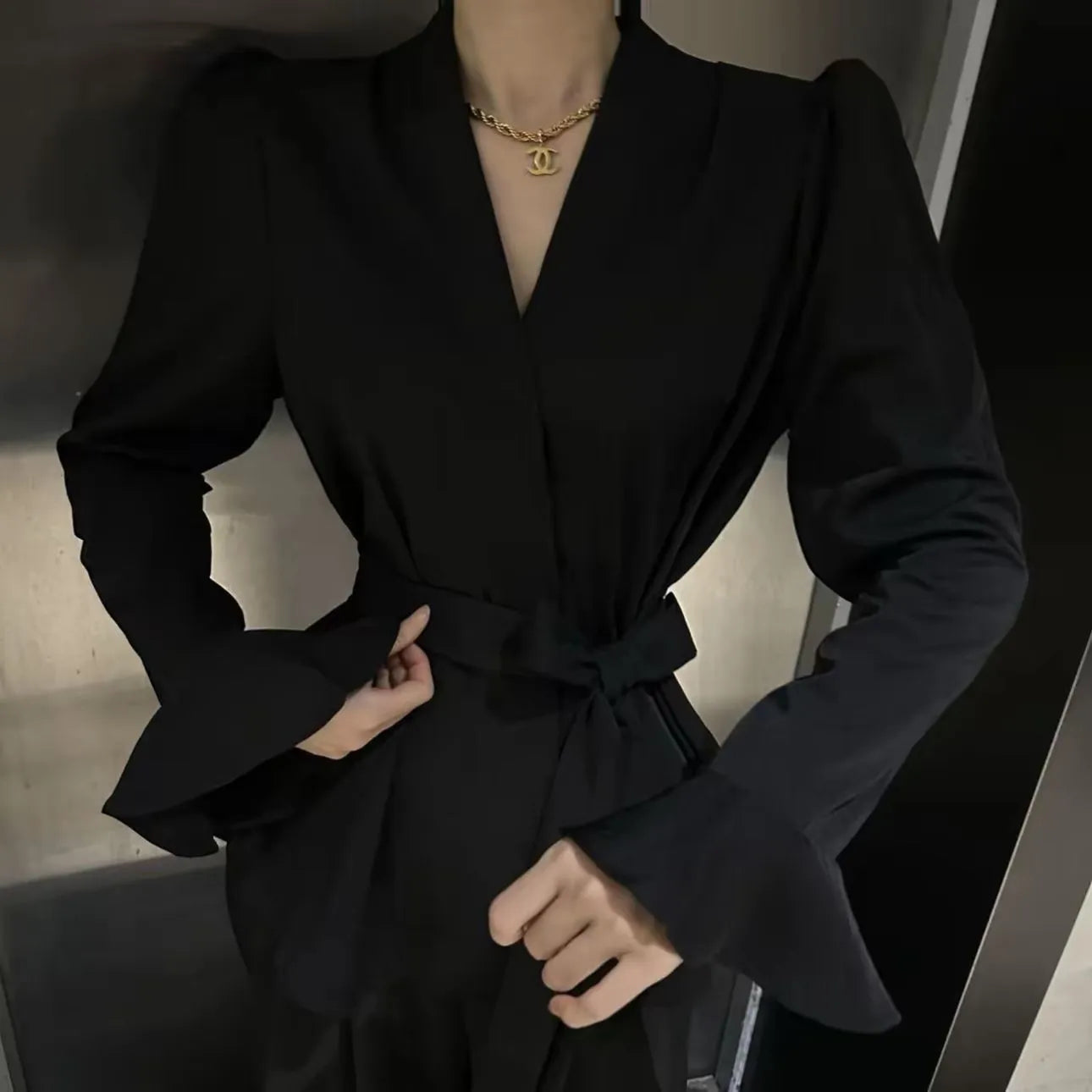 Women's French-style irregular collar long sleeve tied shirt with bell sleeves in polyester fabric