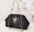 Women's soft polyester dinner bag with chain detailing, document compartment, and shell-shaped design in three colour options