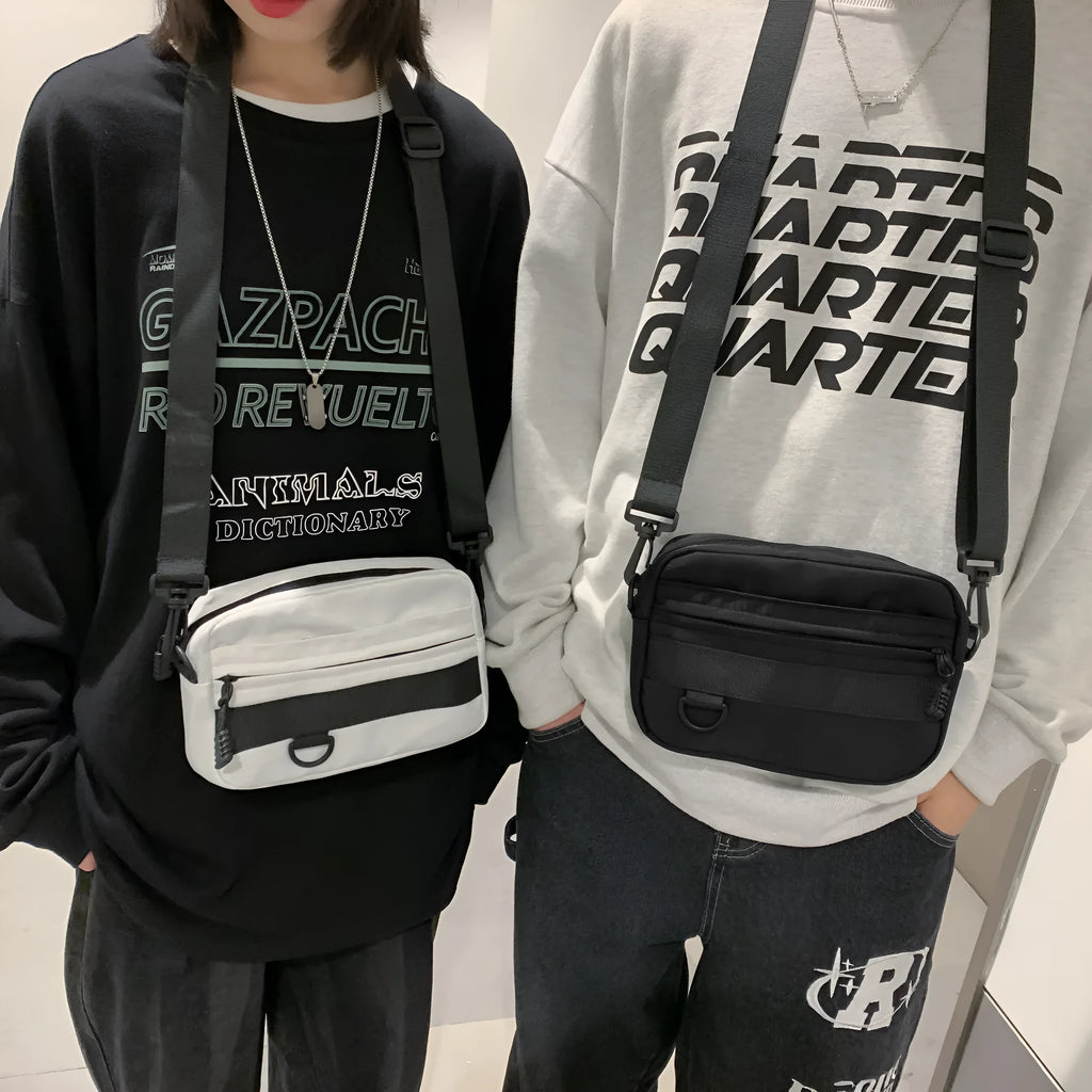 Men's solid color polyester nylon messenger bag with sewing thread detail and crossbody strap in black blue green or white