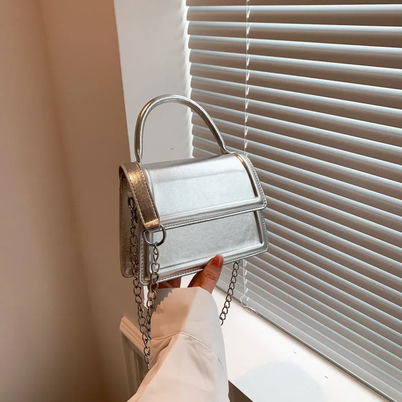 Retro PU leather crossbody bag in horizontal square shape with visible sewing lines