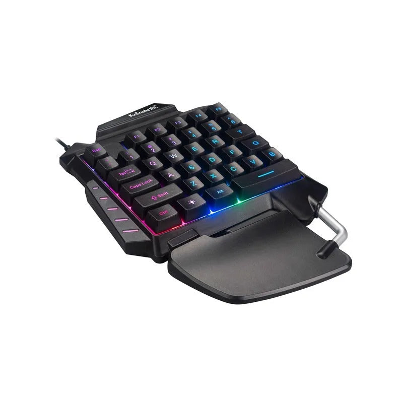 Black one-handed throne converter gaming keyboard with USB cable and integrated palm rest for left-hand desktop gaming