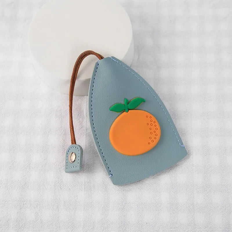 Colourful cartoon pull-out key case made from PU leather, showing the key extended from its protective sleeve.