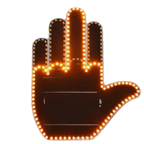 Black plastic LED gesture light for cars showing middle finger symbol with remote control