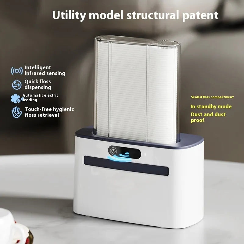 Automatic rechargeable dental floss box in dark grey, gold, and light grey colour options showing pop-up floss mechanism.