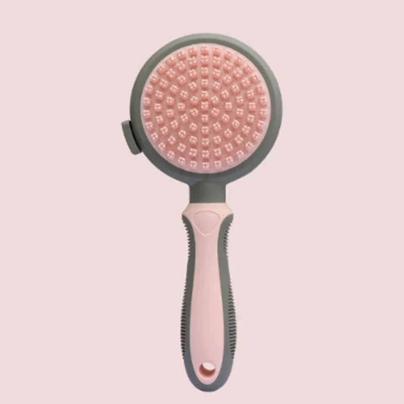 Green and pink two-sided pet grooming brush with a slicker head and a silicone massager head on a textured handle.