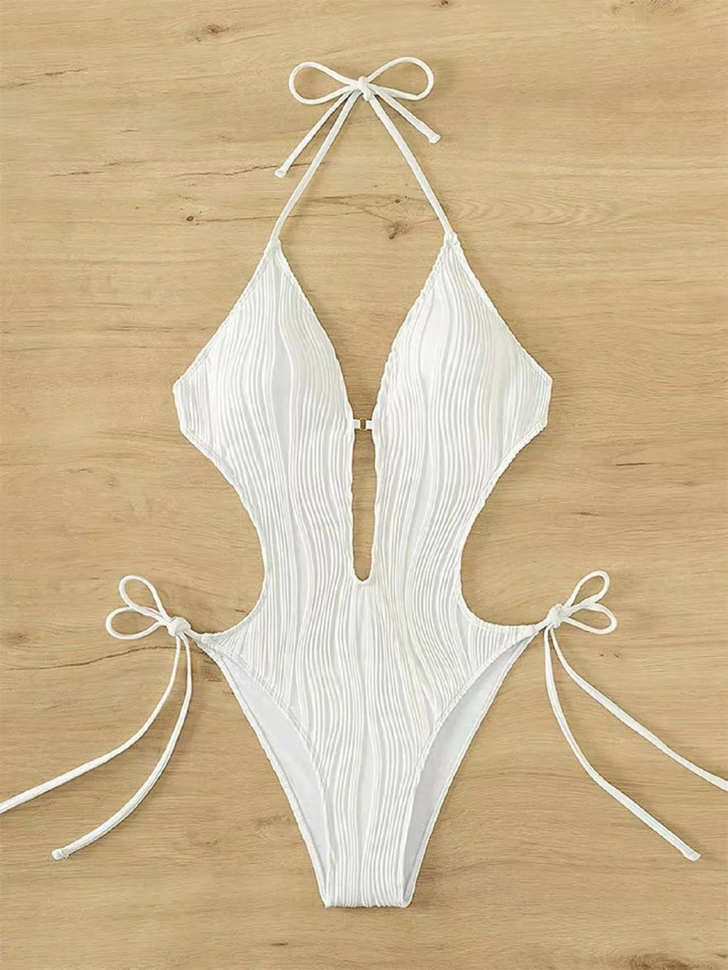 Women's black lace-up triangle bikini swimsuit on a mannequin, front view.