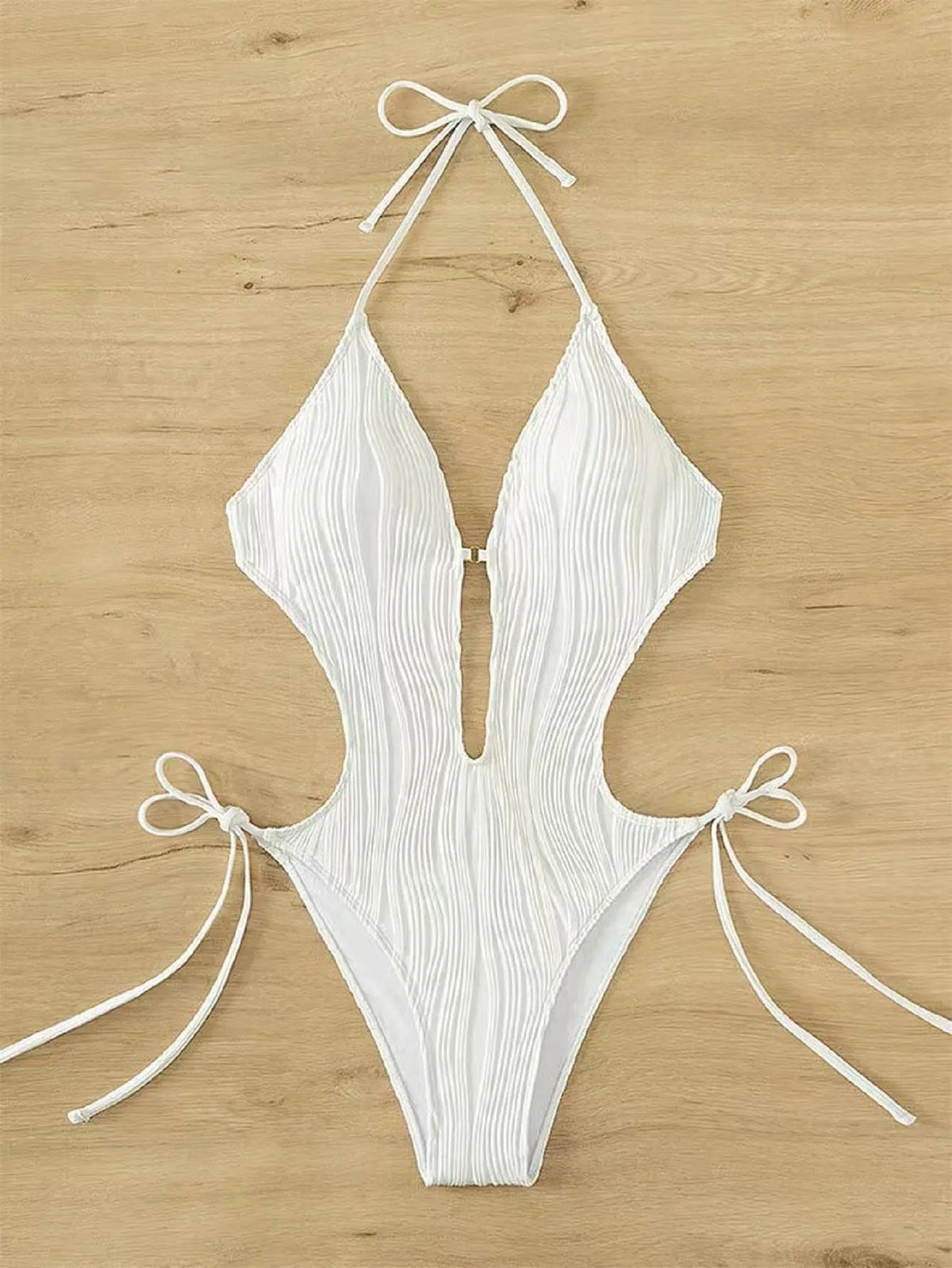 Women's black lace-up triangle bikini swimsuit on a mannequin, front view.