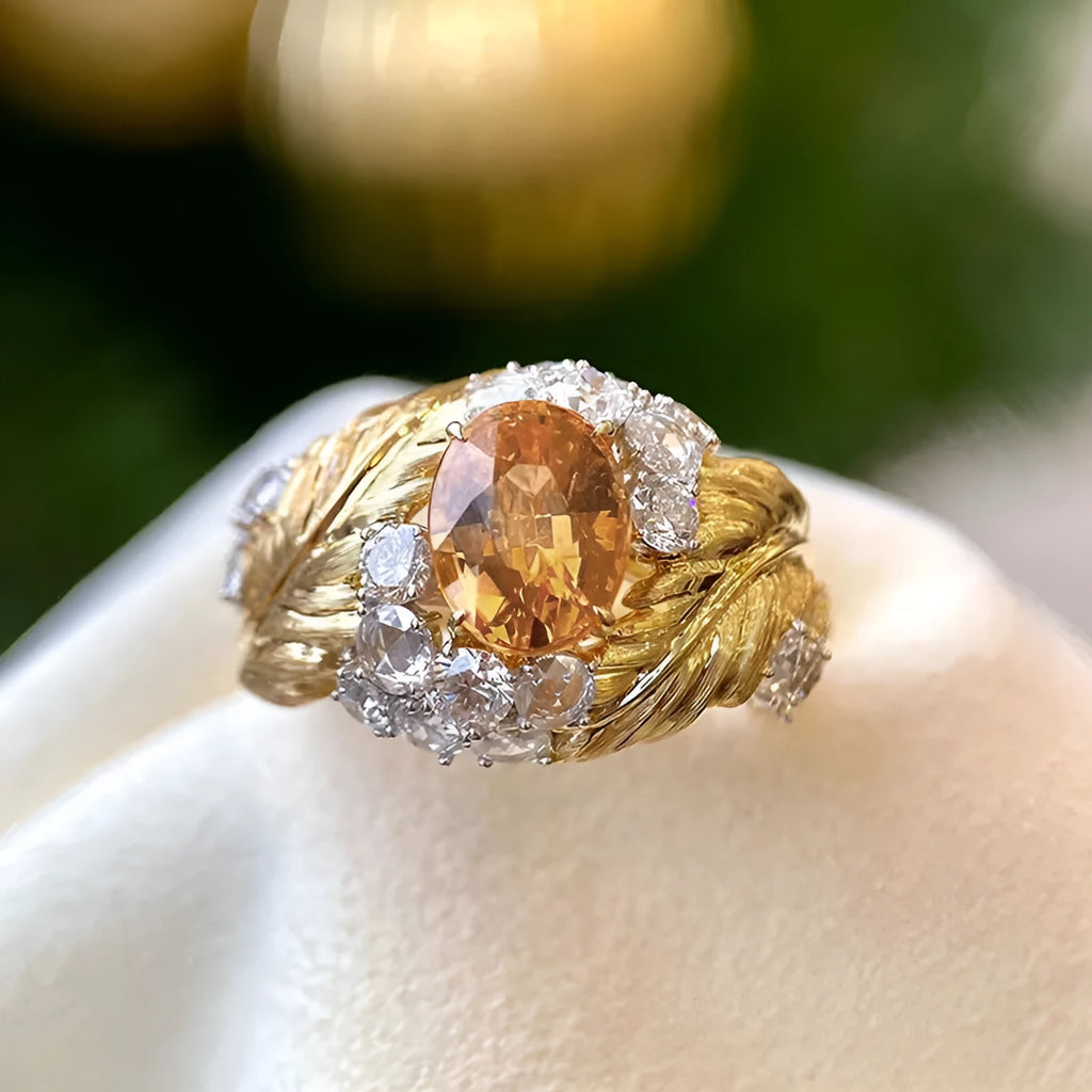Copper women's ring with embossed feather design and yellow zircon stone in gold colour finish