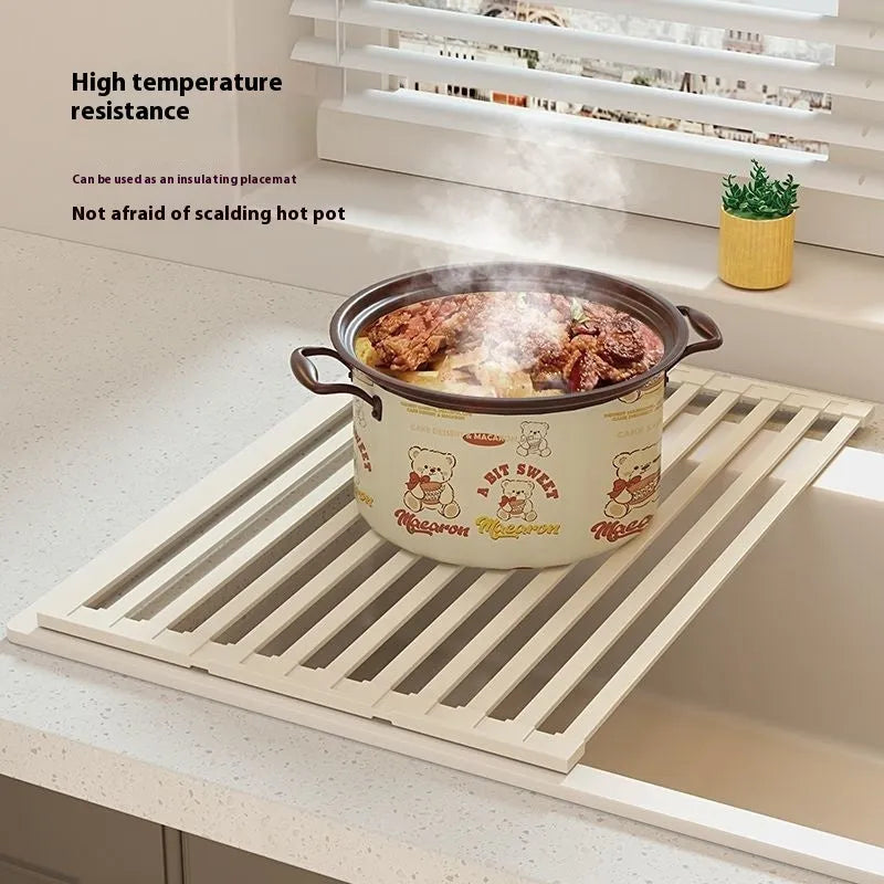 Milky white stainless steel foldable kitchen draining rack with tri-fold design on sink