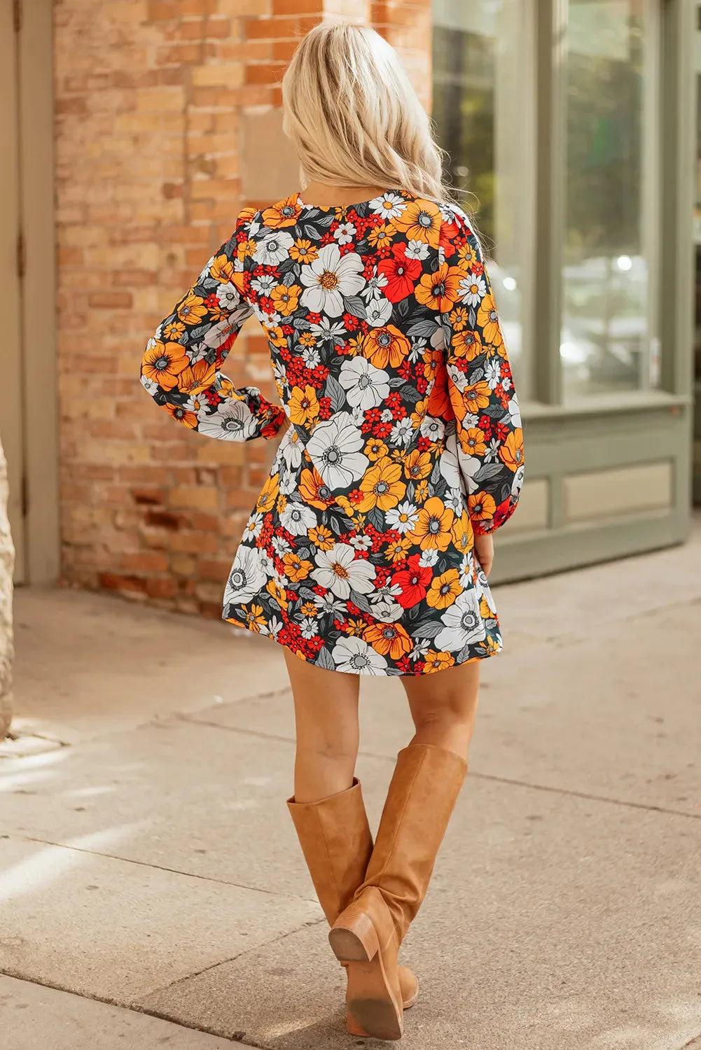 Orange floral print mini dress with V-neck, long sleeves, and striped lace trim