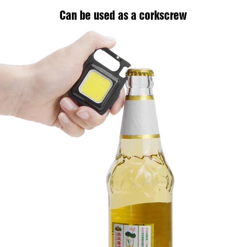 Black aluminium alloy USB keychain light with magnetic base and foldable handle