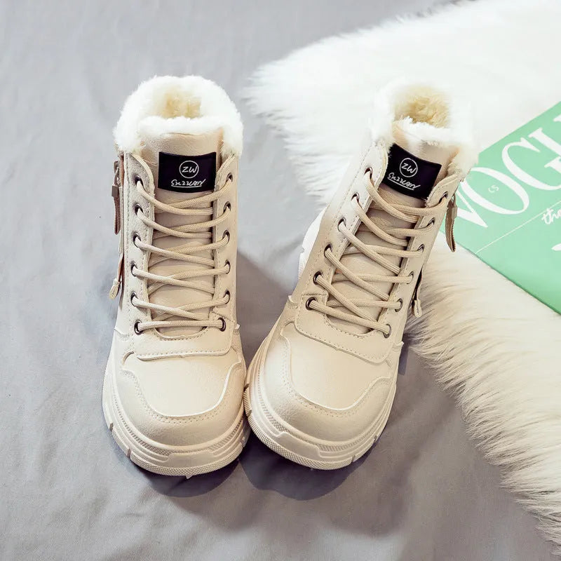 Women's plus size tall snow boot in black with front laces and a mid heel.