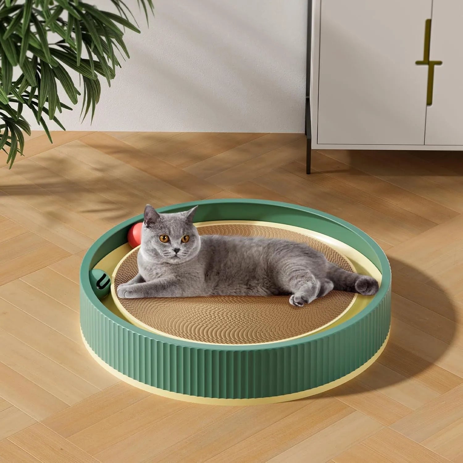 Large circular cardboard cat scratching board with integrated ball toys and replaceable core