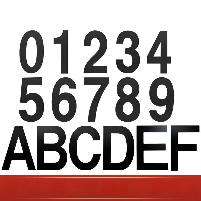Black stainless steel sticky numbers and letters for a house address on a white background.