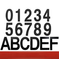 Black stainless steel sticky numbers and letters for a house address on a white background.