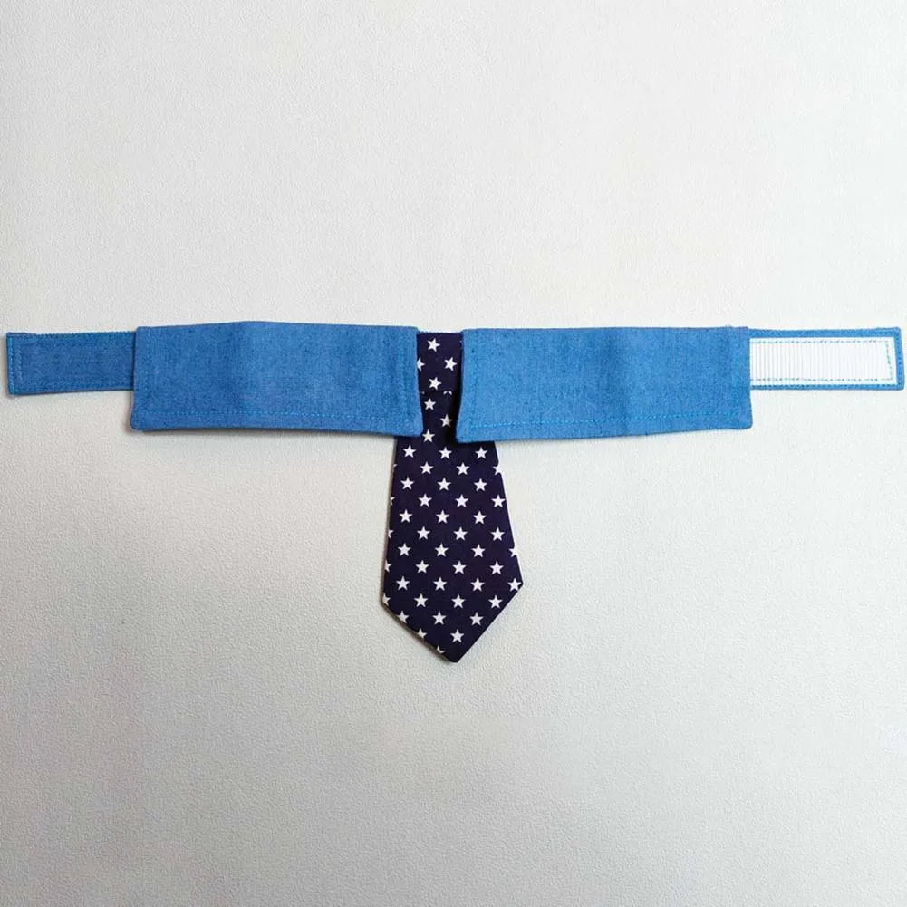 Adjustable denim dog collar with star pattern, shown as a bow tie style on a dog.
