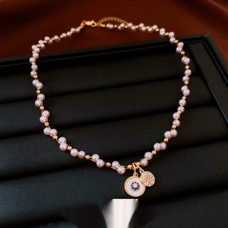 Gold electroplated zircon pearl pendant necklace on adjustable clavicle chain