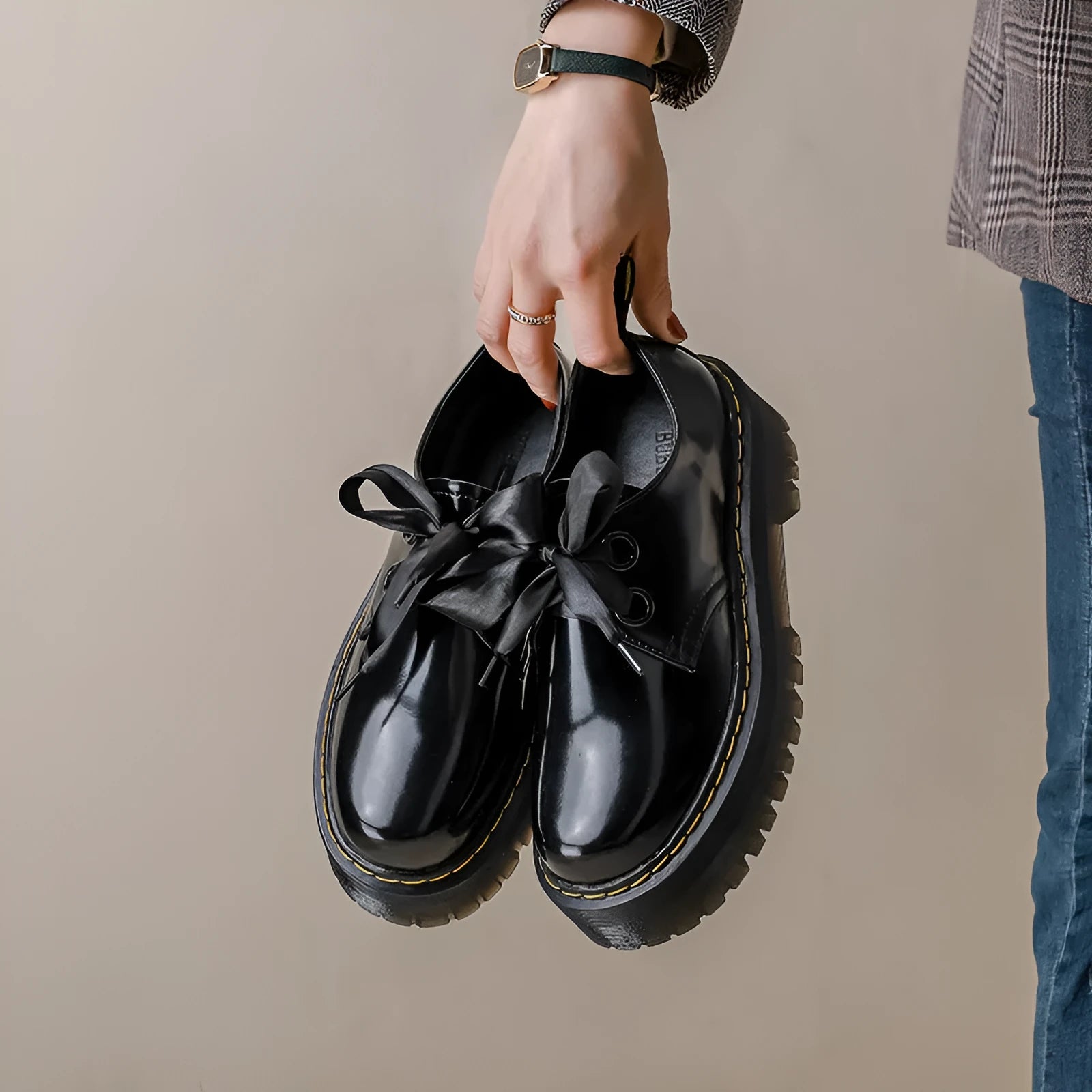 Women's thick soled leather shoes with ribbon details in black and white colour options