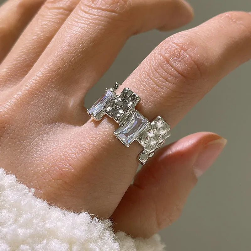 Geometric open silver ring with cross zircon gemstones and three-dimensional decoration