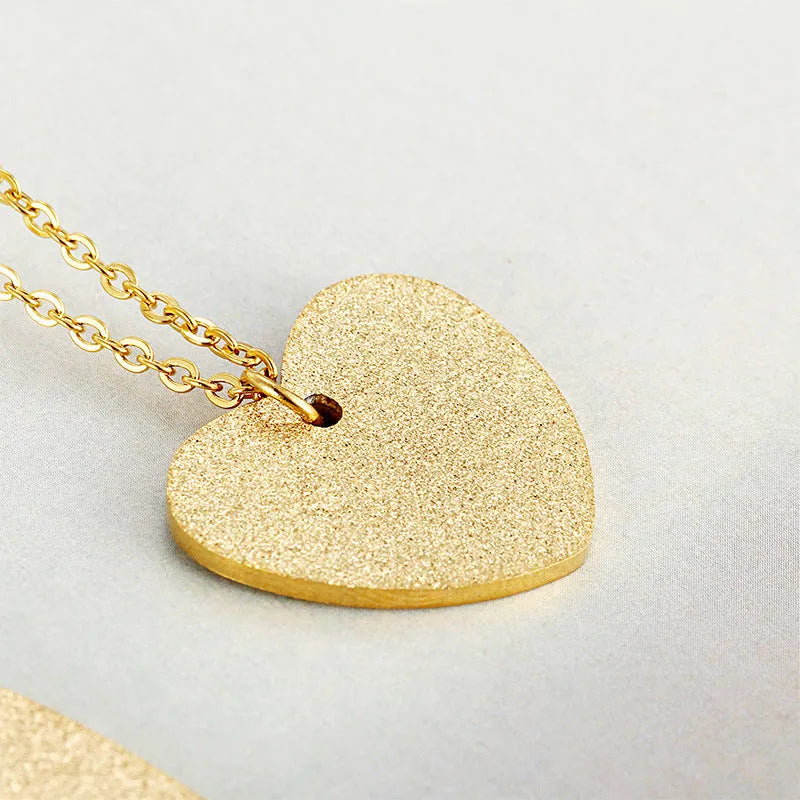 Geometric heart-shaped titanium steel pendant necklace on model, simple fashion style
