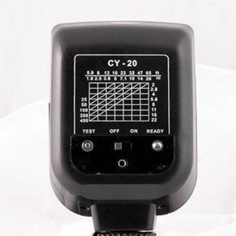Compact black camera flash unit with tilt head showing GN20 specification and 5600K colour temperature label
