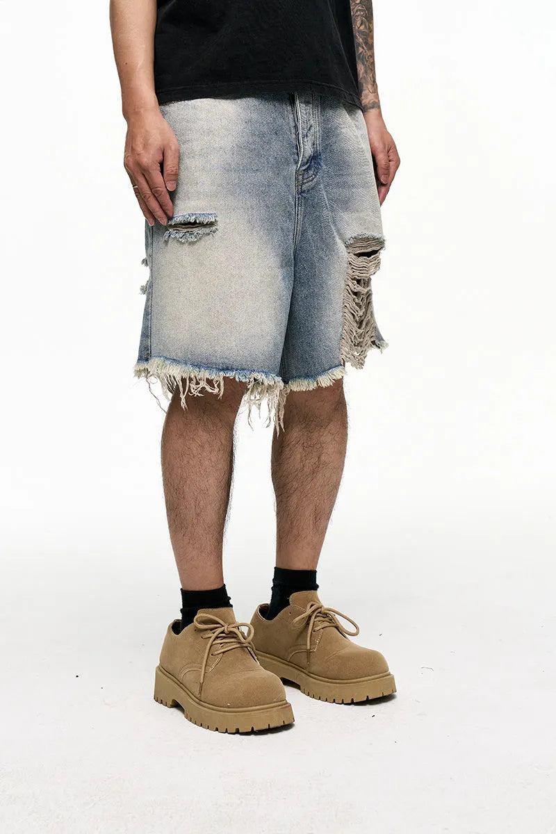 Men's light blue baggy denim shorts with a retro washed finish on a mid-waist