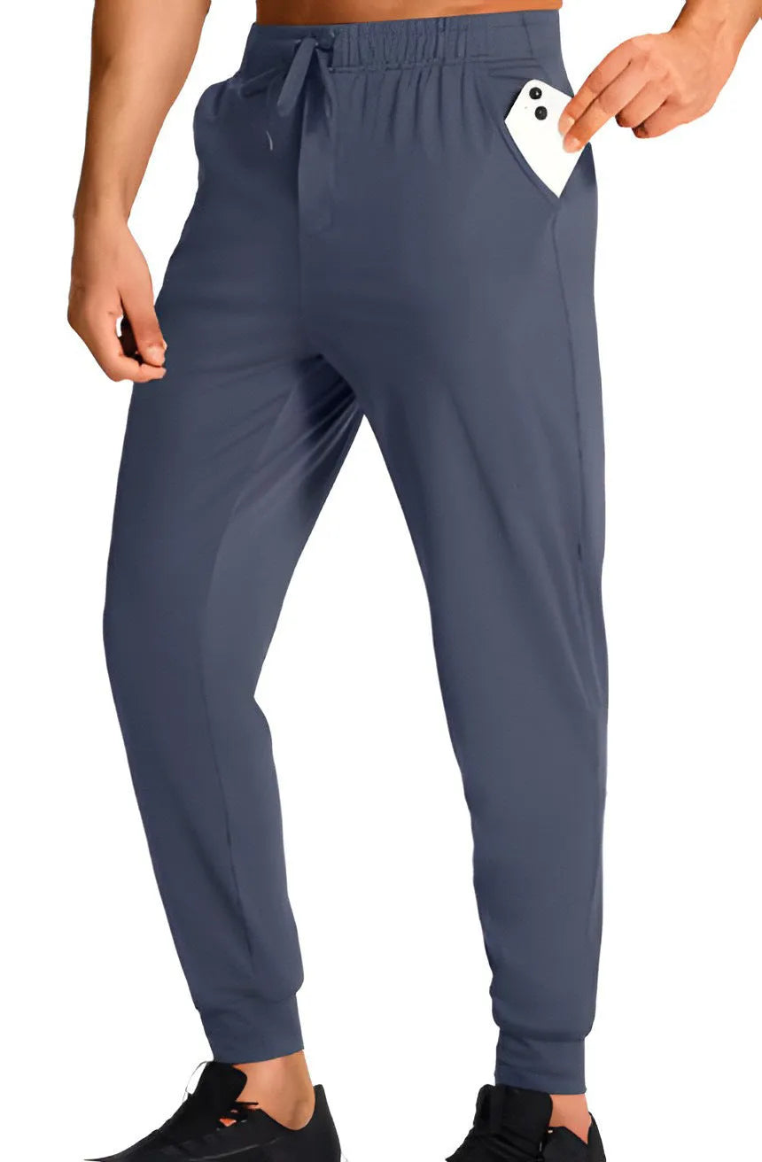 Men's loose-fit casual work trousers in solid colour on hanger, showing relaxed leg cut